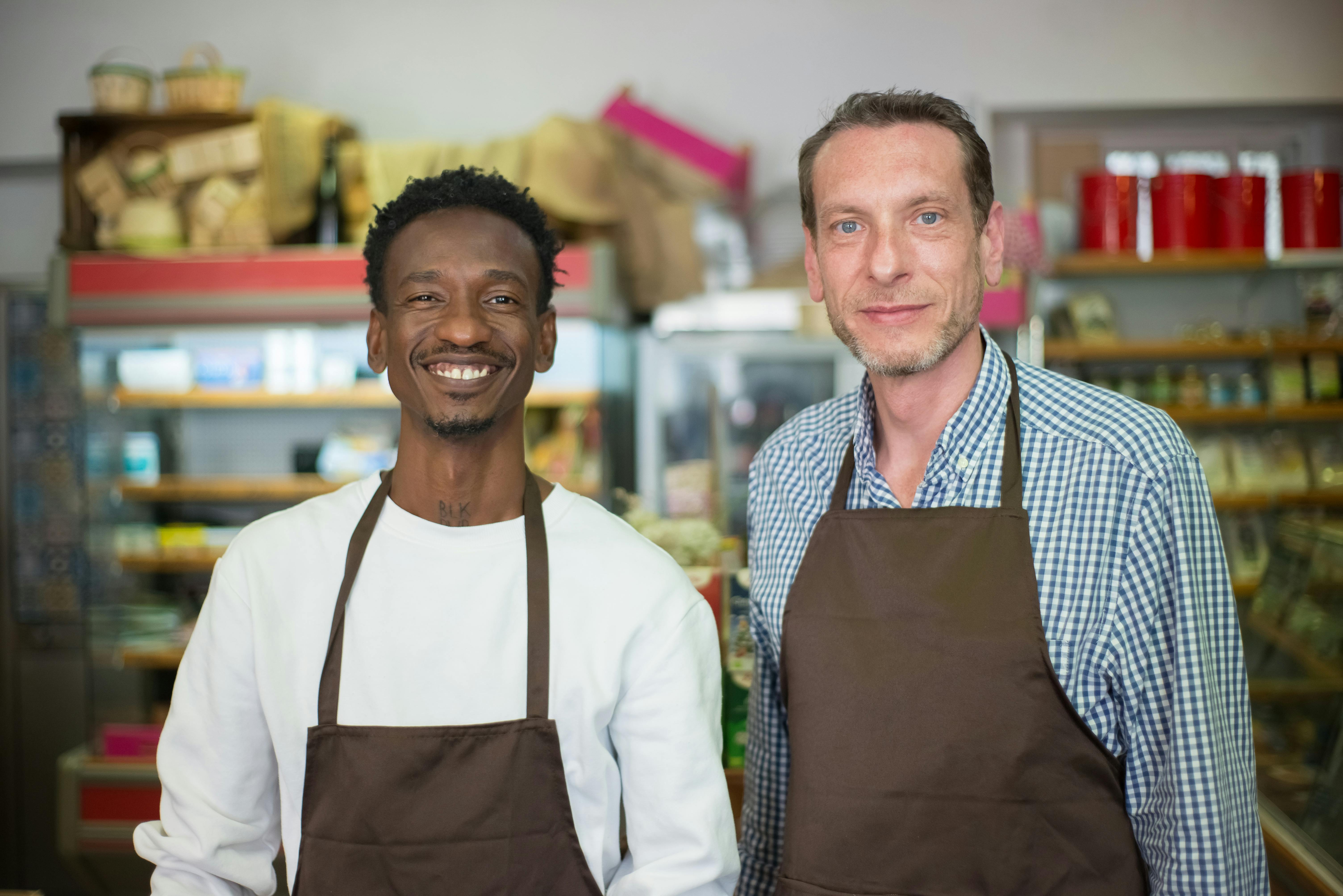 Small business owners and craftsmen in work aprons